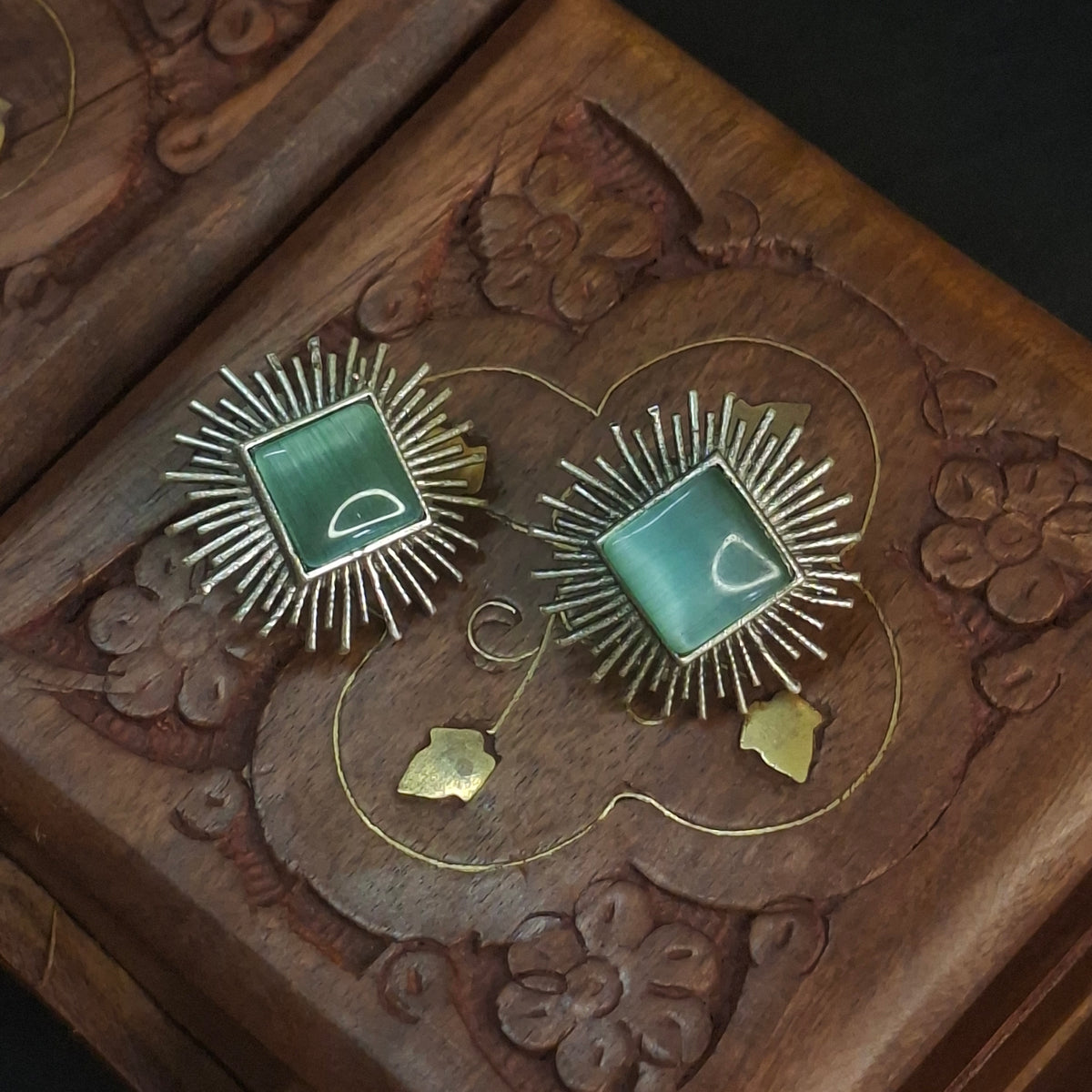 Mint green sunburst studs