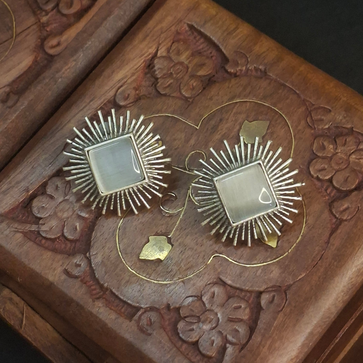 white stone sunburst studs